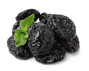 Tasty dried plums (prunes) and mint leaves on white background