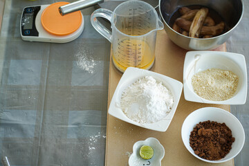 The ingredients for the banana cake flour egg on table.Flat lay concept.