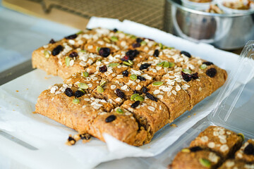 banana bread. this banana bread is homemade, i used brown sugar, flour, egg and also rile bananas. the top of the bread is almond slices, raisin, nuts and oat. the taste is so good and sweet.