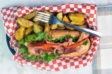 blt  sub  served with potato wedges