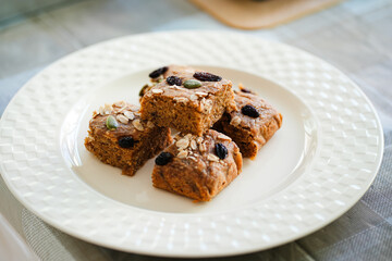 Fresh healthy vegan oat muffins, apple and banana cakes in plate on table.