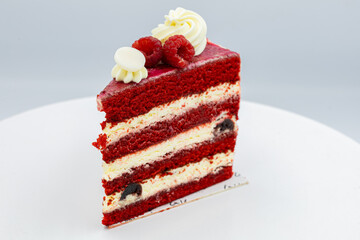  piece of red berry cake on a white plate