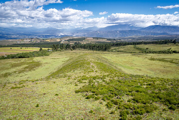 Fields, meadows and plants of the Cochasqui Pyramids Park, in Tabacundo Ecuador, on a beautiful sunny afternoon