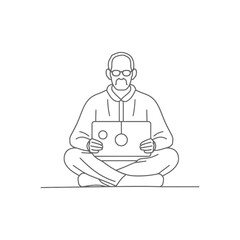 Man with glasses sitting cross legged, using a laptop