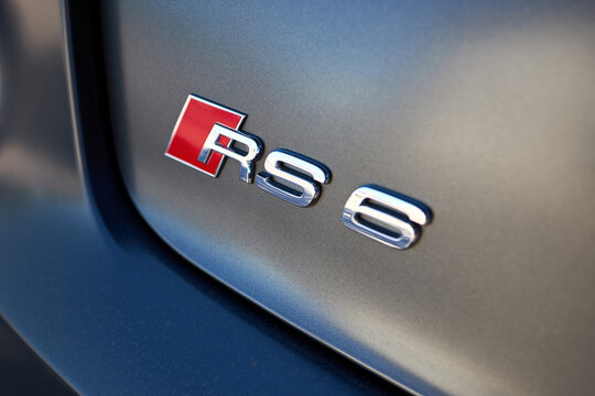 Berlin, Germany - May 12, 2024: Closeup detail of Audi RS 6 RS6 sign badge logo on rear car trunk selective focus shot.