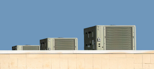 Three Commercial Air Conditioning Units On Grocery Store Roof