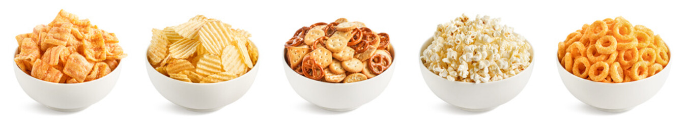 Set of various salty snacks in bowls on white background. Potato chips, popcorn, bacon chips, onion rings, creckers and pretzels