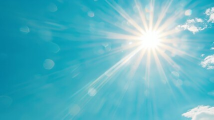 Obraz premium Bright sunbeam shining through a clear blue sky