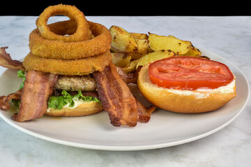 hamburger  with onion rings and bacon