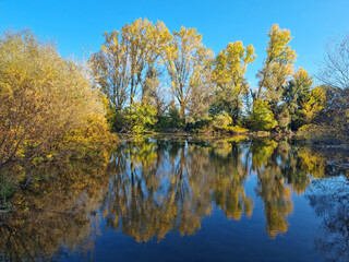 Beautiful Autumn View with reflection at Tundja River, near Ustrem Village, Bulgaria
