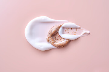 Cream and cream scrub on a pink background. Texture.