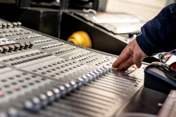 gray sound console being handled