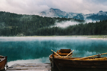 Glacial Mountain Lake with Rowing Boat in foreground - Black Lake, Zabljak, Durmitor National Park, Montenegro - Crno Jezero Incredible Exploration and Travel © Liam