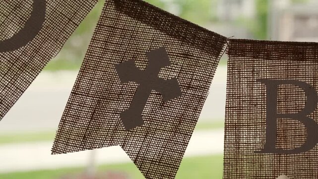 Cross banner hanging in window - extreme close up - Powered by Adobe