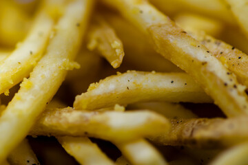 Delicious crispy fries closeup with salted potato fried food for a tasty snack