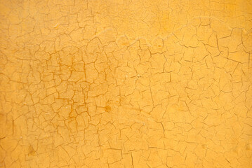 Grungy yellow background. Bright yellow scratched texture.