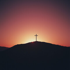 Obraz premium Silhouette of a cross on a hill during sunset