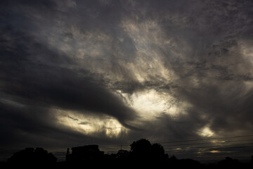 Dramatic clouds in the sky at sunset. Nature background.