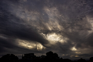 Dramatic clouds in the sky at sunset. Nature background.