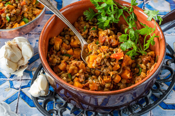 Brown lentils stew with white wine, serrano ham and smoked paprika