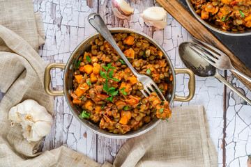 Brown lentils stew with white wine, serrano ham and smoked paprika