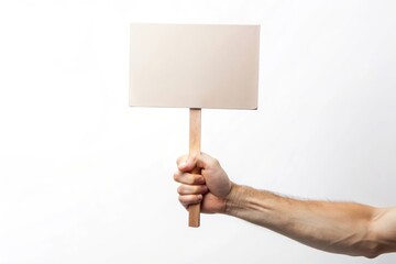 A hand holding a blank sign on a wooden stick, isolated on a white background. This image symbolizes protest, demonstration, message, communication, and blank space for your text.