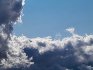 Photo of dark clouds on blue sky.