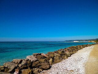 Breakwater on beach in Vada, Italy.