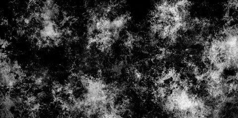 Abstract monochrome texture smoke creates abstract patterns on a black background. Grey and black watercolor smoke art texture background. vintage grunge texture and dark smoke