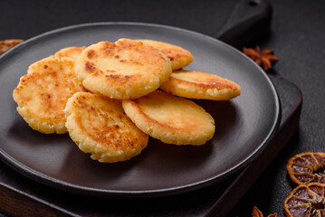 Delicious fresh sweet cheese pancakes with raisins and cinnamon