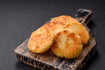 Delicious fresh sweet cheese pancakes with raisins and cinnamon