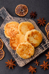 Delicious fresh sweet cheese pancakes with raisins and cinnamon