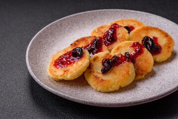 Delicious fresh sweet cheese pancakes with raisins and cinnamon