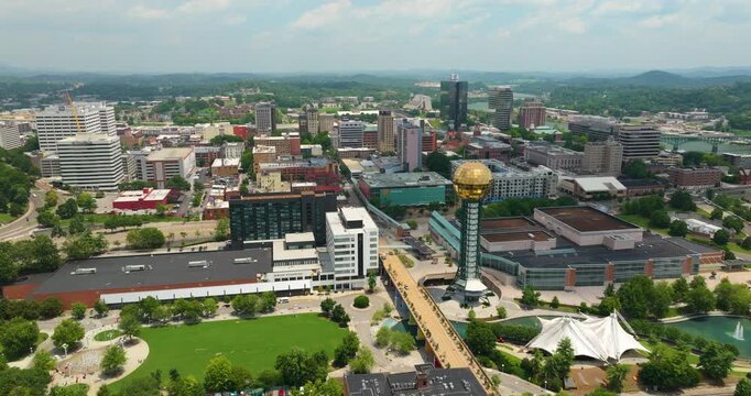 Aerial view of downtown district of Knoxville city in Tennessee, USA. Sunsphere in World's Fair Park and high skyscraper buildings in modern American midtown