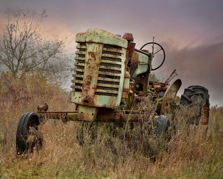 old rusty tractor in field