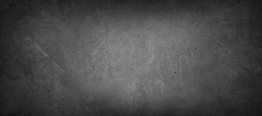 Grey textured concrete wall background. Dark edges