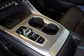 Naklejka premium Macro shot of a car gear lever an essential auto part