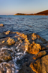 Genoese Agnello tower, Barcaggio, Cap Corse, Corsica, France. Beautifull summer sunset in a beach, Corsica
