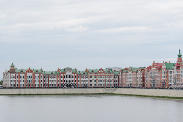 Brugge Embankment on Malaya Kokshaga river in Yoshkar-Ola, Mari El Republic, Russia, colorful buildings