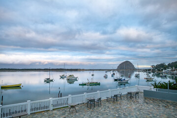 Cloudy, still morning on Morro Bay, California with Morro Rock in the background