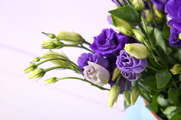 Eustoma flowers on lilac background