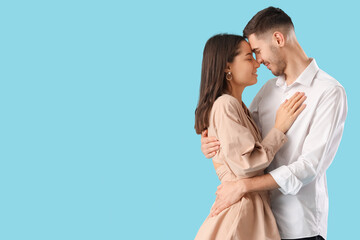 Happy young couple on blue background