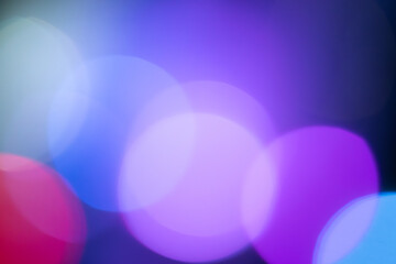 abstract bokeh background, bright multi-colored lanterns  on blue background, shining at a night