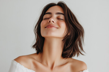 Fototapeta premium A close up of a woman's face with her eyes closed
