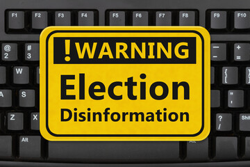  Warning Election Disinformation sign on a keyboard