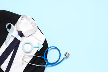 Suit, stethoscope, male sign and light blue ribbon on color background. Prostate cancer awareness
