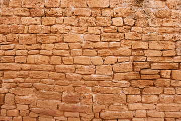 Ancient wall of big yellow stone background