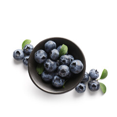 Bowl of ripe blueberry on white background, closeup