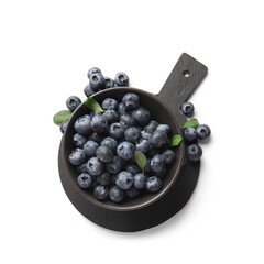Black cutting board and bowl of ripe blueberry on white background, closeup