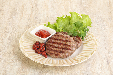 Grilled beef burger cutlet with sauce